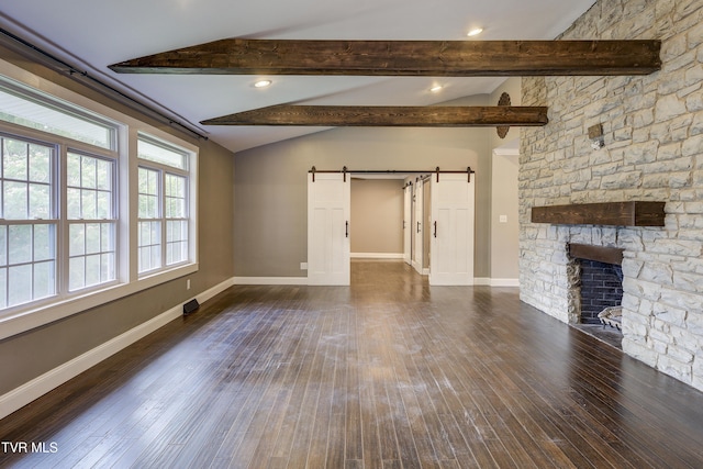 2 Longview Ln, Kingsport, TN 37660 - unfurnished living room with a barn door, dark wood-style floors, and a fireplace