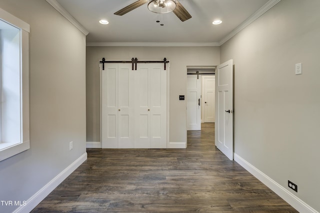 2 Longview Ln, Kingsport, TN 37660 - unfurnished bedroom with a barn door, crown molding, dark wood finished floors, recessed lighting, and a closet