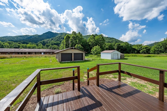 157 Spring St, Hampton, TN 37658 - wooden deck with an outbuilding, a mountain view, a garage, and a lawn
