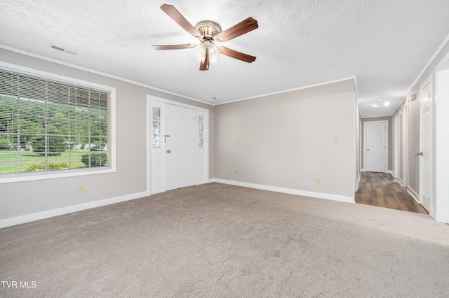 157 Spring St, Hampton, TN 37658 - carpeted foyer entrance with crown molding, a textured ceiling, and a ceiling fan
