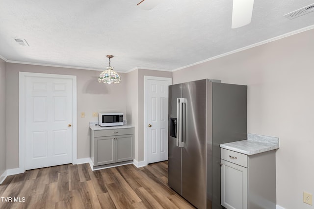 157 Spring St, Hampton, TN 37658 - kitchen with white microwave, high end fridge, wood finished floors, light countertops, and a textured ceiling