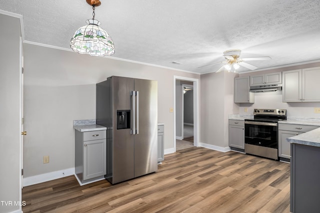 157 Spring St, Hampton, TN 37658 - kitchen with stainless steel appliances, under cabinet range hood, gray cabinets, ceiling fan, and wood finished floors