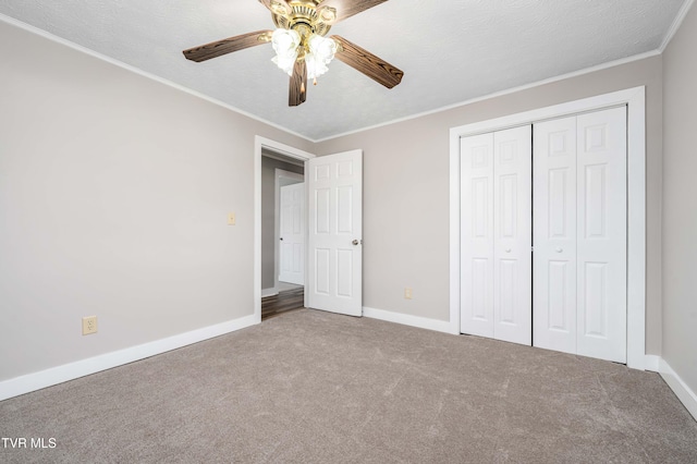 157 Spring St, Hampton, TN 37658 - unfurnished bedroom with carpet floors, a closet, crown molding, and a ceiling fan