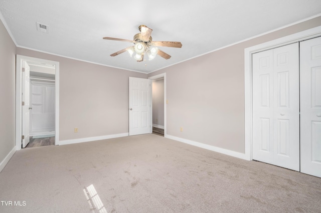 157 Spring St, Hampton, TN 37658 - unfurnished bedroom featuring light carpet, ornamental molding, a closet, ensuite bathroom, and ceiling fan