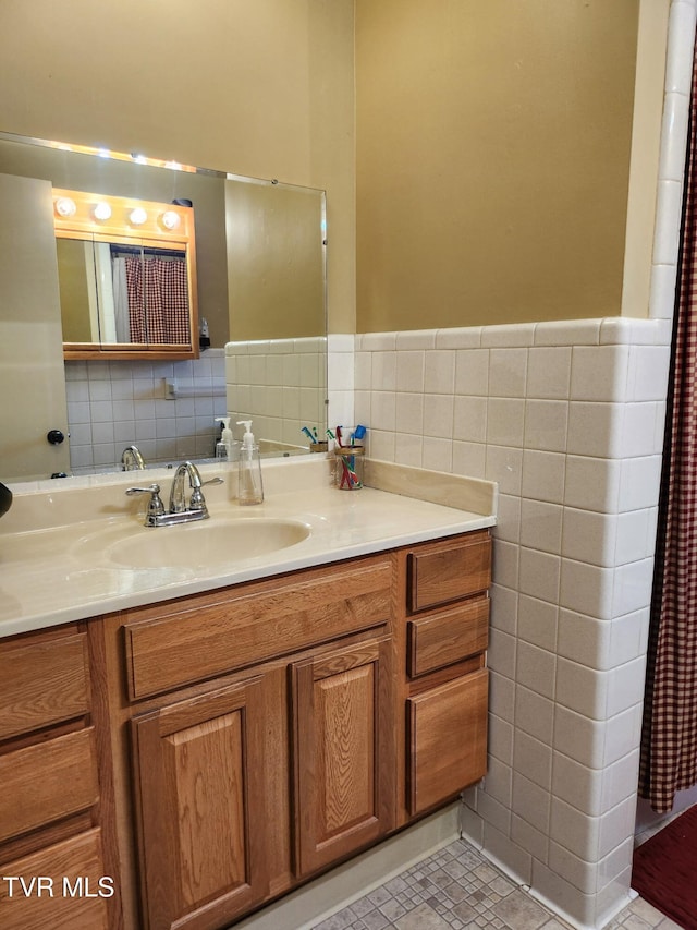 2020 Oakland St, Kingsport, TN 37660 - bathroom with tile walls, vanity, wainscoting, and tile patterned floors