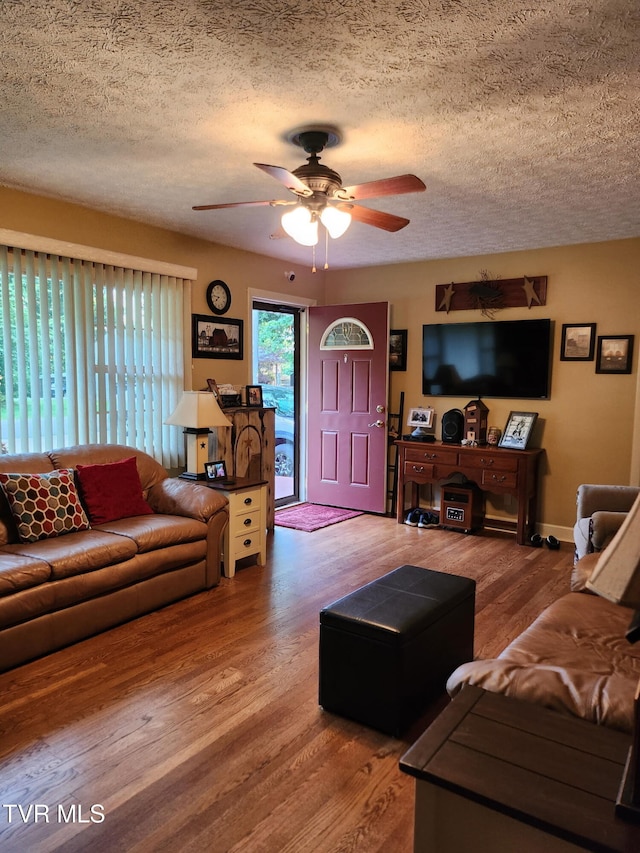 2020 Oakland St, Kingsport, TN 37660 - living room featuring ceiling fan, a textured ceiling, and wood finished floors