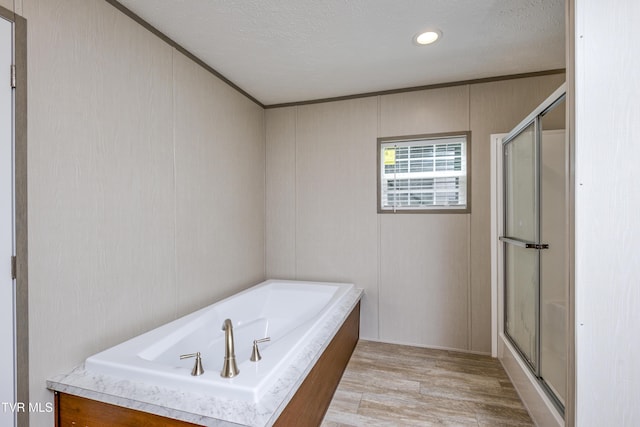 8492 Reedy Creek Rd, Bristol, VA 24202 - full bath with a shower stall, a bath, wood finished floors, recessed lighting, and a textured ceiling