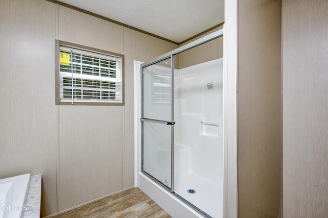 8492 Reedy Creek Rd, Bristol, VA 24202 - bathroom with a stall shower, ornamental molding, and wood finished floors