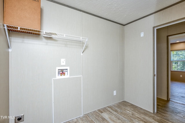 8492 Reedy Creek Rd, Bristol, VA 24202 - laundry area featuring hookup for an electric dryer, wood finished floors, washer hookup, a textured ceiling, and crown molding