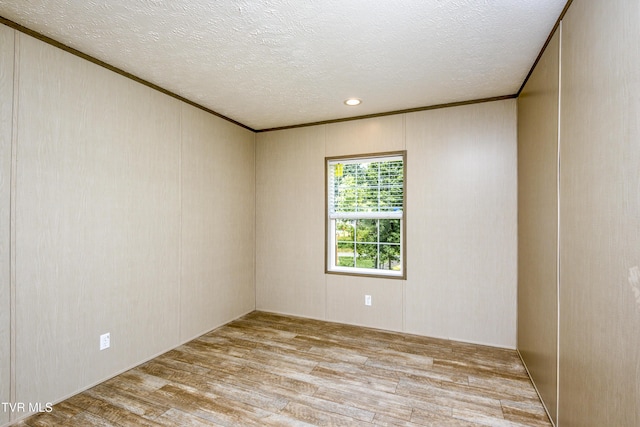 8492 Reedy Creek Rd, Bristol, VA 24202 - spare room featuring wood finished floors, a textured ceiling, ornamental molding, and recessed lighting