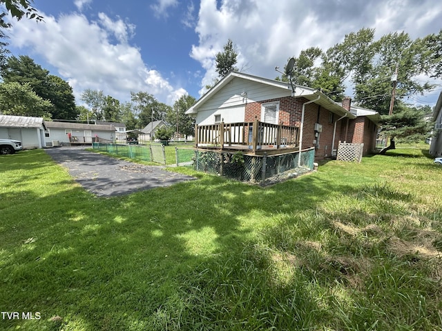 406 NE Mason Ave, Wise, VA 24293 - view of side of home featuring brick siding, a wooden deck, and a chimney