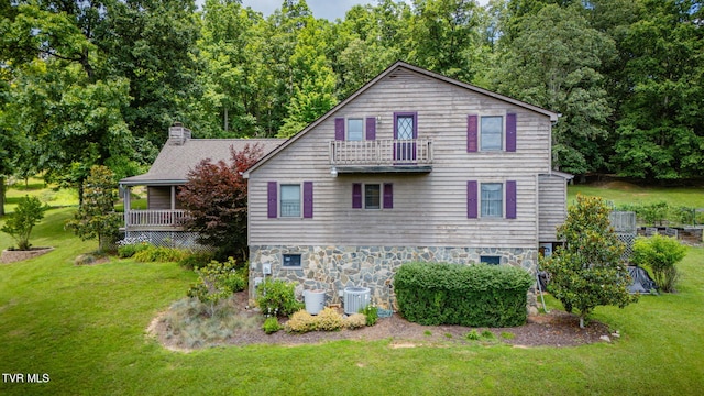 236 Wadlow Gap Rd, Kingsport, TN 37660 - view of home's exterior featuring stone siding, a lawn, a chimney, and a balcony