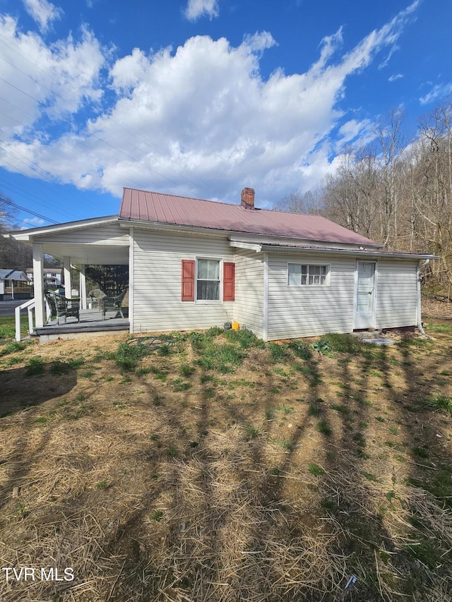 32222 Old Saltworks Rd, Meadowview, VA 24361 - rear view of property featuring a metal roof and a chimney
