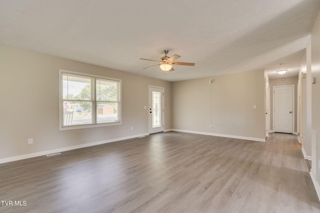 6215 Snapps Ferry Rd, Afton, TN 37616 - unfurnished living room with ceiling fan, wood finished floors, and a textured ceiling