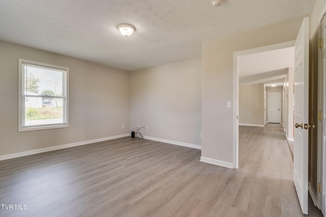 6215 Snapps Ferry Rd, Afton, TN 37616 - unfurnished room featuring light wood-style floors and a textured ceiling