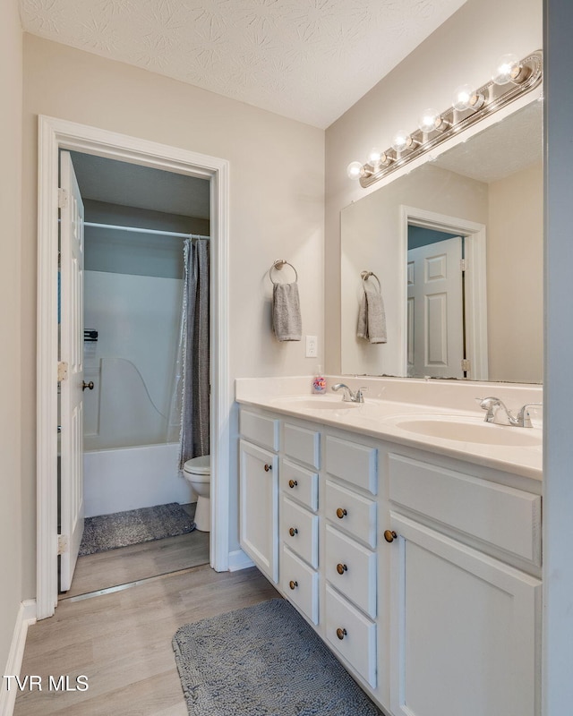 6215 Snapps Ferry Rd, Afton, TN 37616 - full bathroom with double vanity, wood finished floors, and shower / bath combo