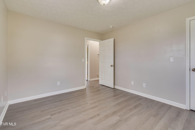 6215 Snapps Ferry Rd, Afton, TN 37616 - spare room with light wood-style flooring and a textured ceiling
