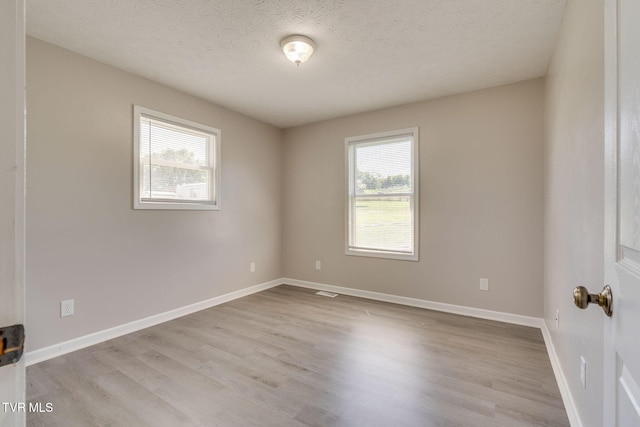 6215 Snapps Ferry Rd, Afton, TN 37616 - spare room featuring wood finished floors and a textured ceiling