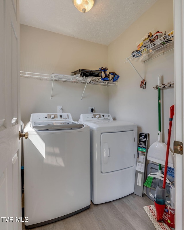 6215 Snapps Ferry Rd, Afton, TN 37616 - laundry area with washer and clothes dryer and light wood-style flooring
