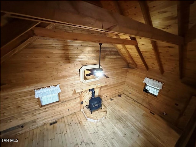 912 Hawkins Rd, Laurel Bloomery, TN 37680 - unfurnished living room with wooden walls, a wood stove, wood ceiling, and hardwood / wood-style floors