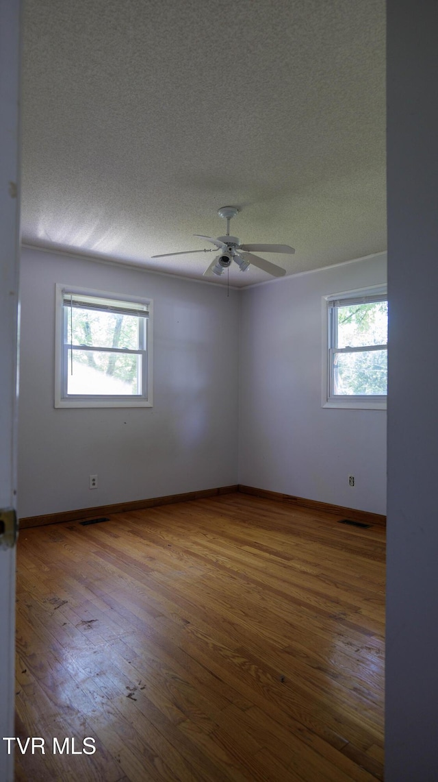 221 Timber Ridge Rd, Jonesborough, TN 37659 - spare room with a textured ceiling, wood finished floors, and a ceiling fan