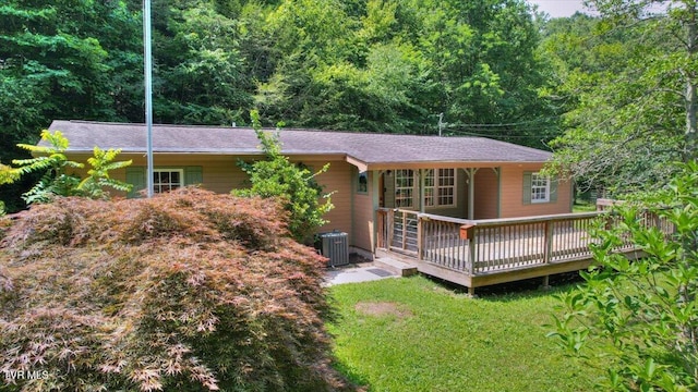 542 Sigman Hollow Rd, Bluff City, TN 37618 - view of front facade with a deck, a front lawn, and a view of trees