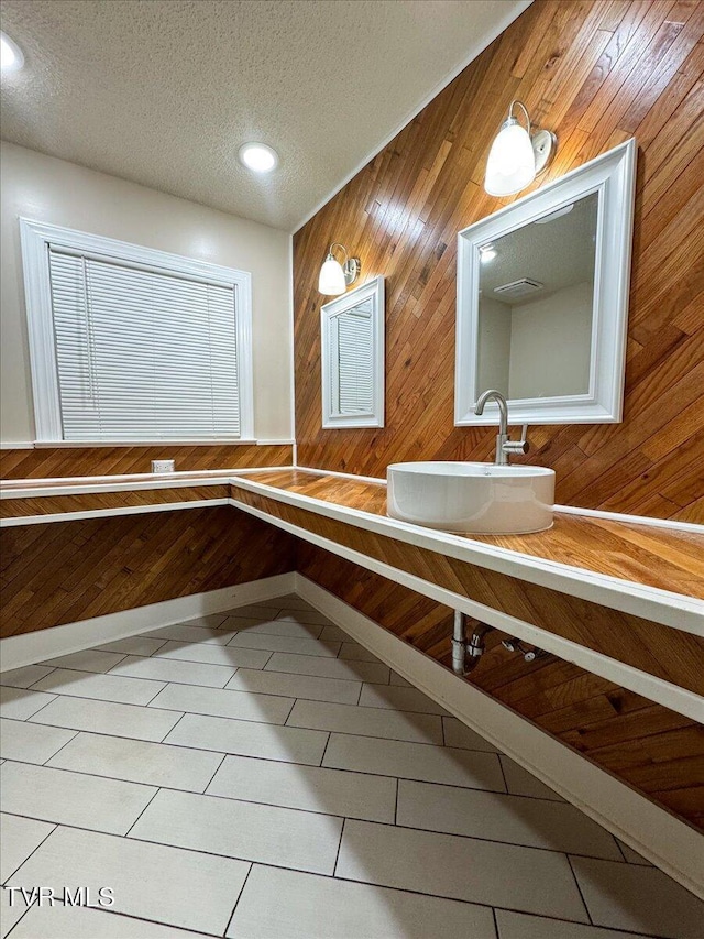 542 Sigman Hollow Rd, Bluff City, TN 37618 - bathroom featuring tile patterned floors, wood walls, a textured ceiling, recessed lighting, and vanity