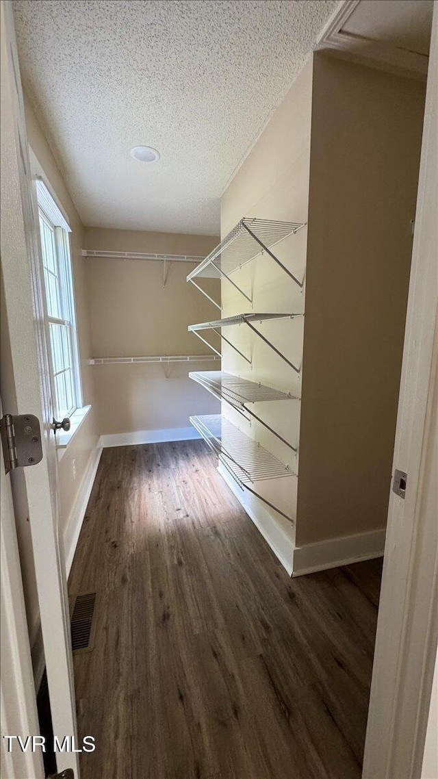 542 Sigman Hollow Rd, Bluff City, TN 37618 - spacious closet featuring wood finished floors