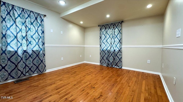542 Sigman Hollow Rd, Bluff City, TN 37618 - empty room with wood finished floors and recessed lighting