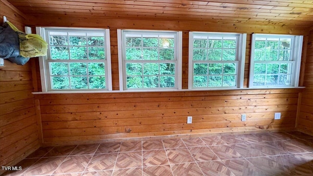 542 Sigman Hollow Rd, Bluff City, TN 37618 - spare room with healthy amount of natural light, wooden walls, and wood ceiling