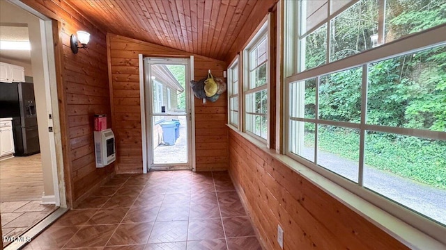 542 Sigman Hollow Rd, Bluff City, TN 37618 - doorway to outside with vaulted ceiling, wood walls, heating unit, and wooden ceiling