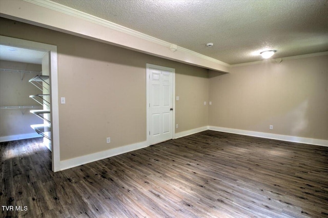 542 Sigman Hollow Rd, Bluff City, TN 37618 - finished below grade area with a textured ceiling, crown molding, and dark wood-style flooring