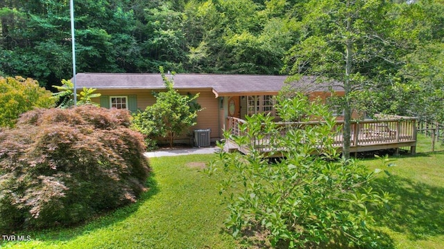 542 Sigman Hollow Rd, Bluff City, TN 37618 - rear view of house with a lawn, a wooden deck, and a view of trees