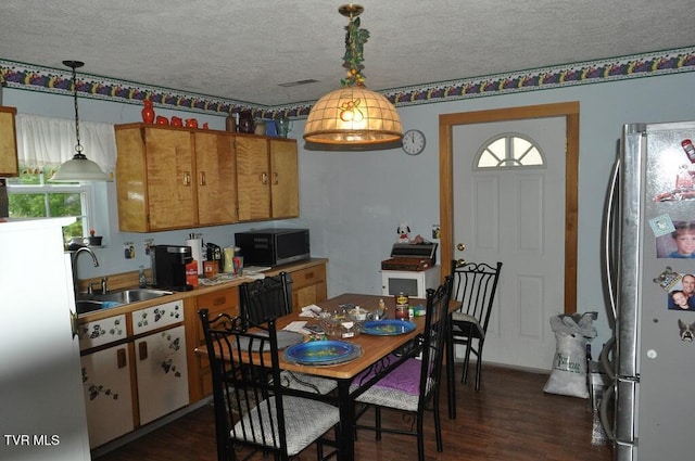7125 Indian Creek Rd, Wise, VA 24293 - dining area featuring dark wood-type flooring, a textured ceiling, and plenty of natural light