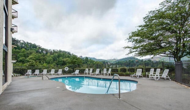 102 Baskins Creek Byp Unit 209, Gatlinburg, TN 37738 - community pool with a patio