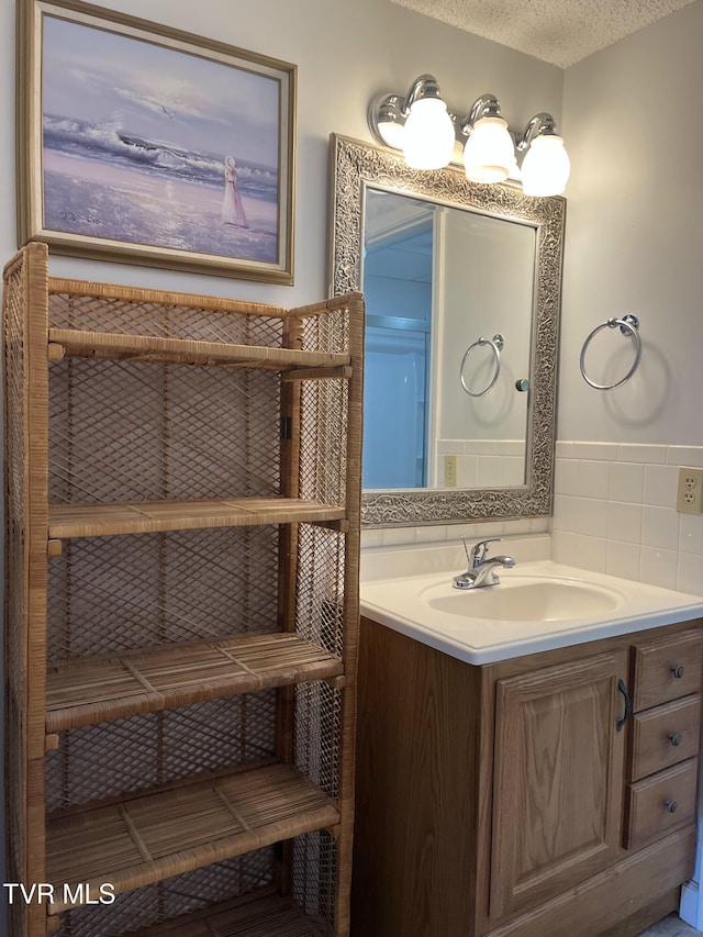 102 Baskins Creek Byp Unit 209, Gatlinburg, TN 37738 - bathroom featuring vanity and a textured ceiling