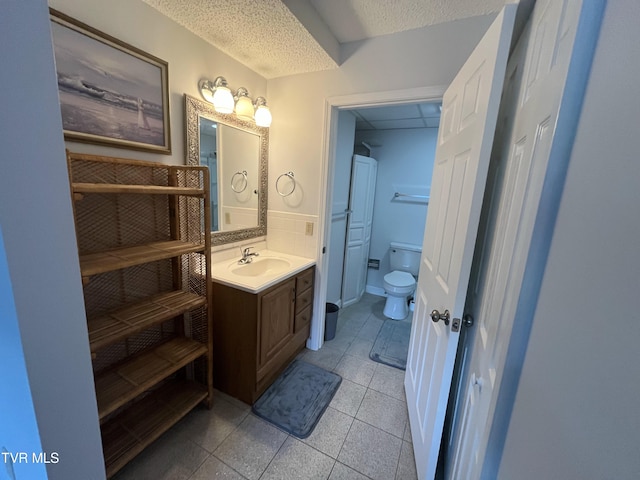 102 Baskins Creek Byp Unit 209, Gatlinburg, TN 37738 - bathroom with tile patterned floors, vanity, and a textured ceiling