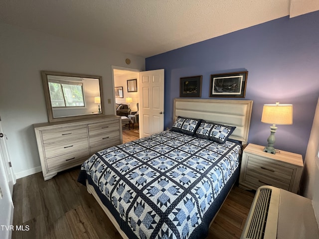 102 Baskins Creek Byp Unit 209, Gatlinburg, TN 37738 - bedroom with dark wood-type flooring and a textured ceiling