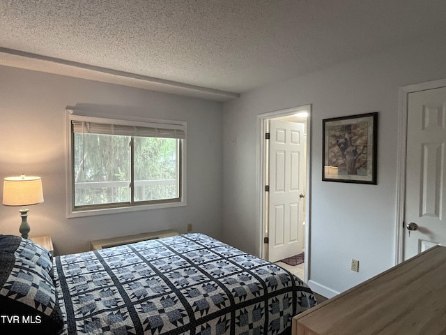 102 Baskins Creek Byp Unit 209, Gatlinburg, TN 37738 - bedroom with a textured ceiling