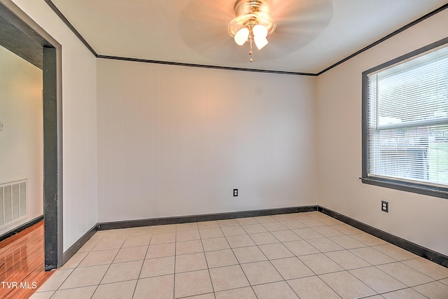 8822 Rich Valley Rd, Bristol, VA 24202 - empty room with a ceiling fan, ornamental molding, and light tile patterned flooring