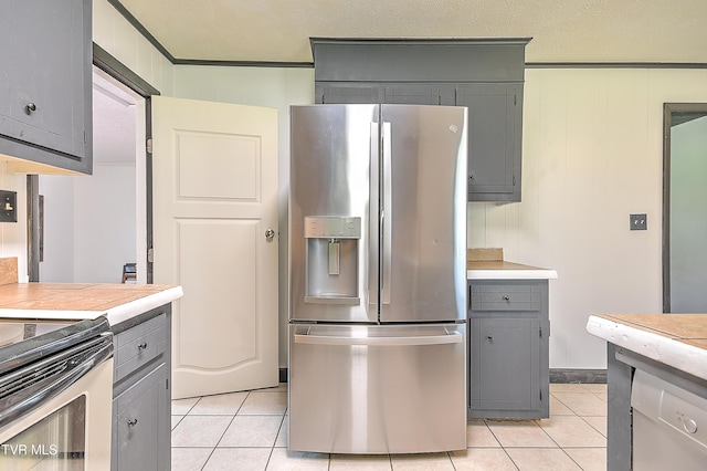 8822 Rich Valley Rd, Bristol, VA 24202 - kitchen featuring stainless steel fridge with ice dispenser, gray cabinets, light tile patterned floors, light countertops, and ornamental molding