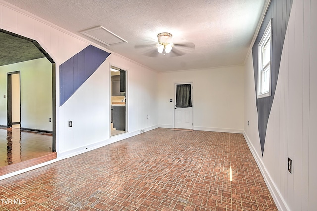 8822 Rich Valley Rd, Bristol, VA 24202 - unfurnished room featuring brick patterned flooring, ceiling fan, a textured ceiling, and ornamental molding