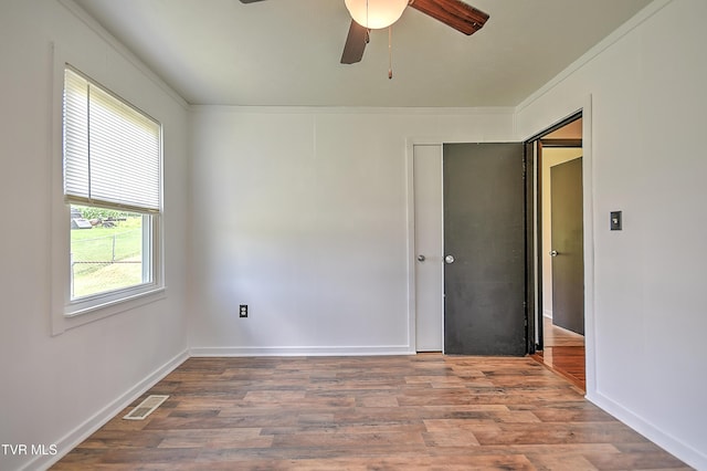 8822 Rich Valley Rd, Bristol, VA 24202 - unfurnished room featuring ornamental molding, a ceiling fan, and wood finished floors