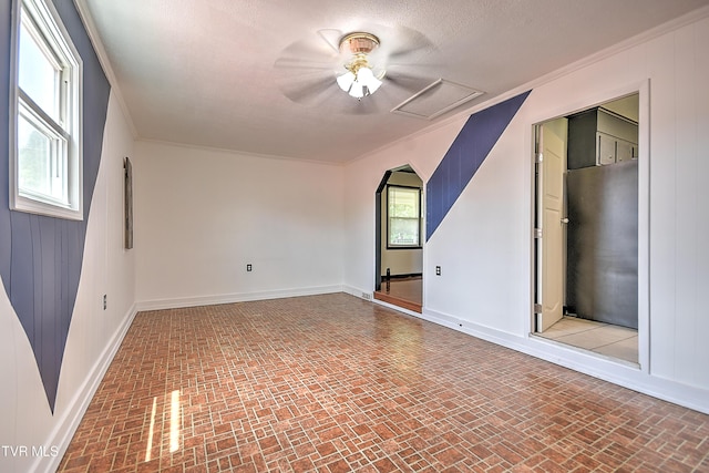 8822 Rich Valley Rd, Bristol, VA 24202 - spare room featuring brick patterned floors, ornamental molding, and attic access