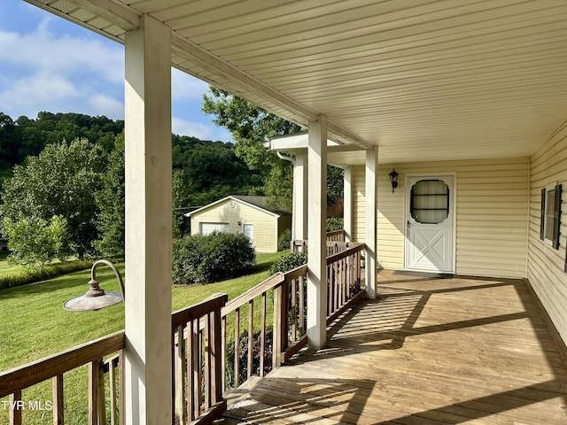 1277 Old Jonesboro Rd, Bristol, TN 37620 - wooden porch featuring a yard and an outbuilding