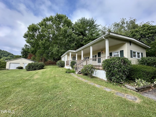 1277 Old Jonesboro Rd, Bristol, TN 37620 - view of property exterior featuring covered porch, a yard, and a detached garage