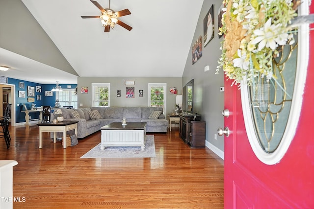 1014 Fox Meadow Cir, Bluff City, TN 37618 - living area with high vaulted ceiling, a ceiling fan, and light wood-style floors