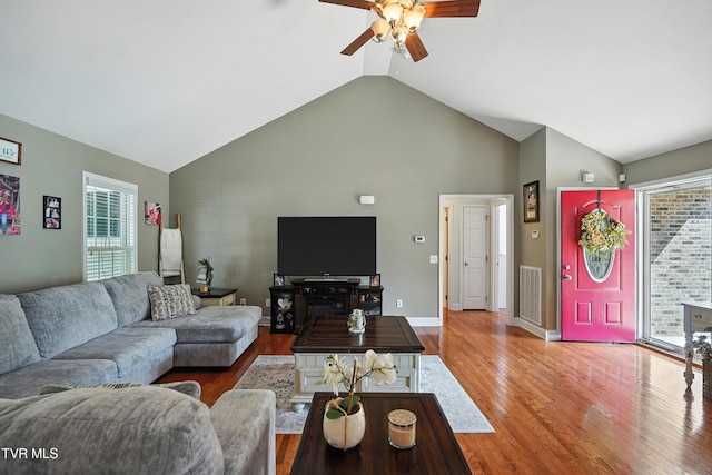 1014 Fox Meadow Cir, Bluff City, TN 37618 - living area featuring ceiling fan, high vaulted ceiling, healthy amount of natural light, and wood finished floors