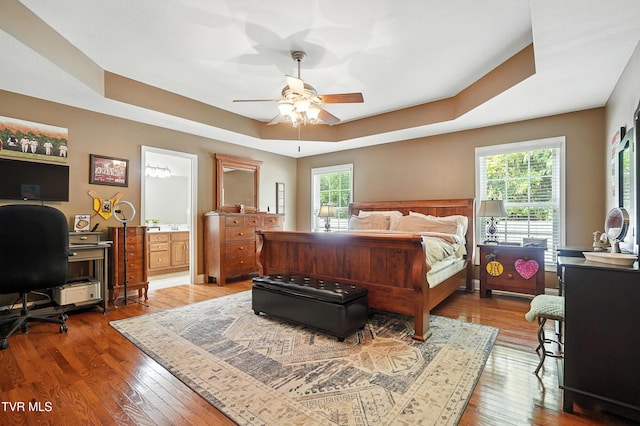 1014 Fox Meadow Cir, Bluff City, TN 37618 - bedroom with multiple windows, a raised ceiling, hardwood / wood-style floors, and a desk
