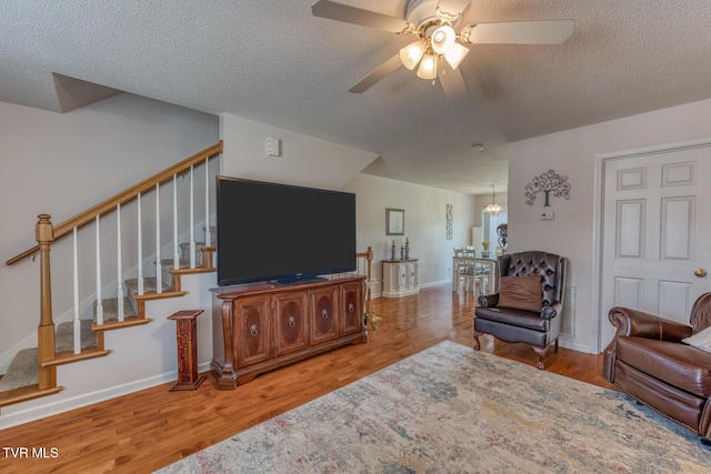 147 Rainbow Cir Unit 147, Bristol, VA 24202 - living room featuring a ceiling fan, wood finished floors, a textured ceiling, and stairs